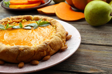 Homemade pumpkin pie on table