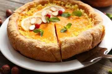 Homemade pumpkin pie on table