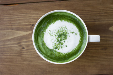 Matcha green tea latte beverage in glass.