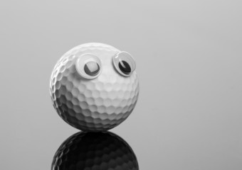 Golf ball with plastic eyes