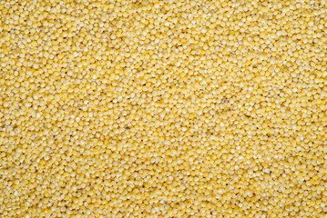 food background of yellow grains of millet