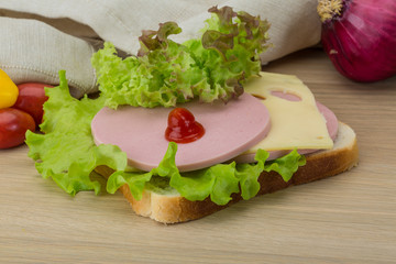 Sandwich with cheese and sausages
