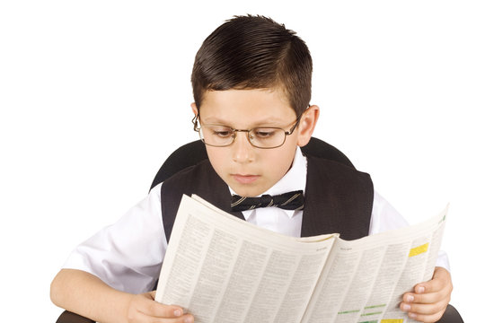 Young business man reading the newspaper