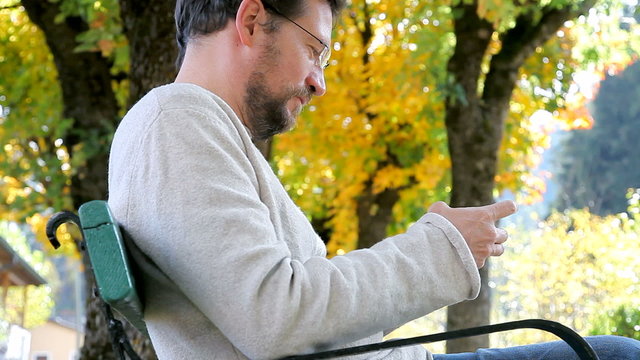 Man texting with new iphone 6 happy