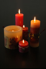 composition of lighting candles on a dark background