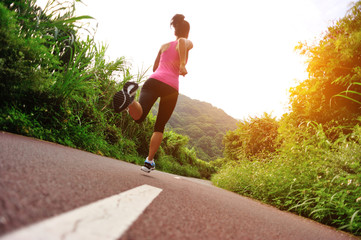 fitness woman runner running on trail