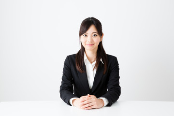 asian businesswoman sitting on the table