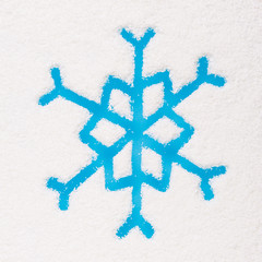 Snowflake painted on frozen window