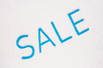 Word sale painted on frozen window