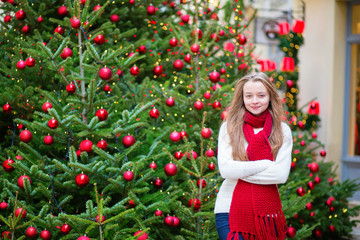 Girl with decorated Christmas tree