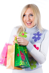 Pretty smiling girl with shopping bags