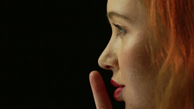 Young Woman Gesturing Quiet or Shushing