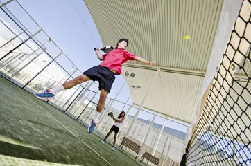 Foto op Canvas Paddle tennis player smashing the ball © FotoAndalucia