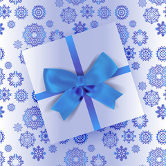 white gift with ribbon and bow