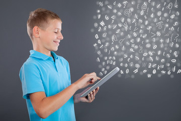 young boy using tablet,school learning or technology concept