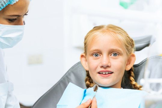 Dentist inspecting patient