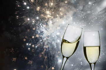 Champagne glasses against holiday lights