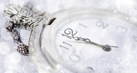 New Year's at midnight - Old clock and holiday lights
