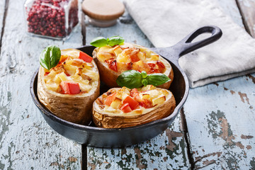Stuffed potatoes with cheese and tomato