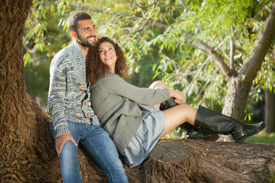 smiling couple in love in autumn in park