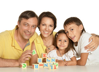 Obraz na płótnie Canvas Family playing with cubes