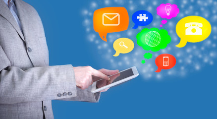 Business man use tablet pc with colorful application icons