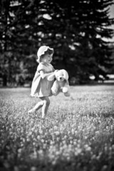 child playing with their dog