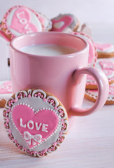 pink cup with milk and homemade cookies