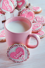 pink cup with milk and homemade cookies