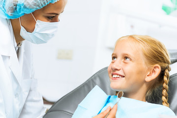 Dentist inspecting patient