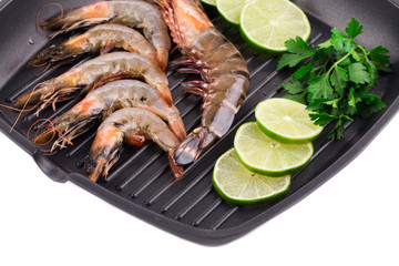 Fragment raw shrimps on frying pan.