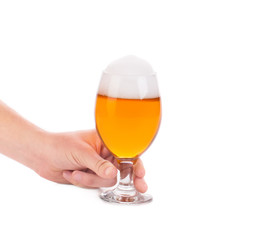 Glass of light beer in hand.