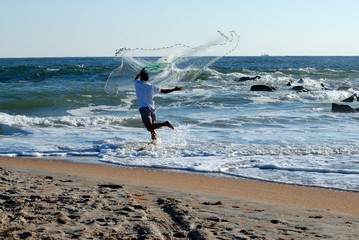 Man with bait casting net