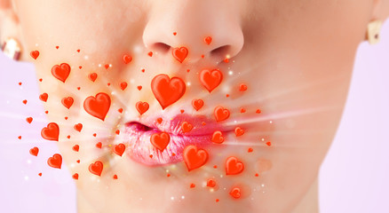 Obraz na płótnie Canvas Pretty lady lips with lovely red hearts