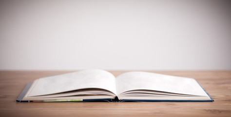 Open book on wooden deck