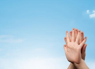 Happy smiley fingers looking at clear blue sky copyspace