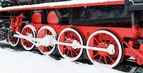 Wheel retro locomotive snow winter, red wheels at the back of