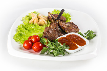 Roasted lamb chops with tomatos