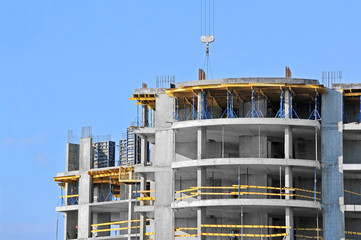 Building construction site work against blue sky