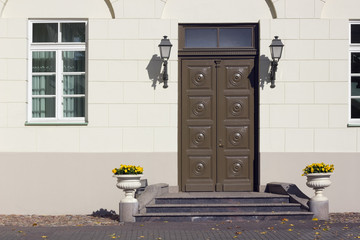 Yellow wall and old brown  wooden door