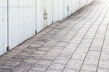 close - up street floor tiles and concrete wall