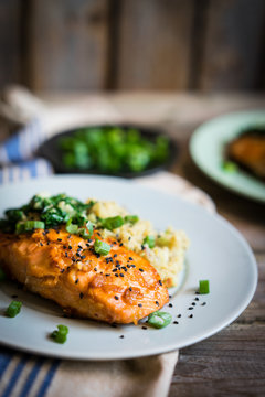 Salmon steak with mashed potatoes and greens