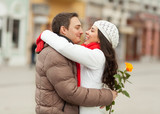 Young couple in a downtown hugging