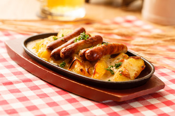 roasted potatoes with sausage in the bar