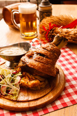 eisbein with braised cabbage, salad and beer