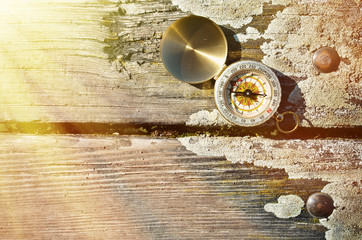 Compass on the wooden background