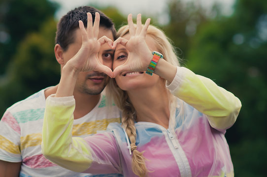 Portrait of Smiling Beauty Girl and her Handsome Boyfriend makin