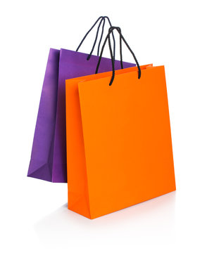 Two paper Shopping bags with reflection on white