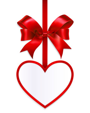 Red gift bow with ribbon and heart tag.