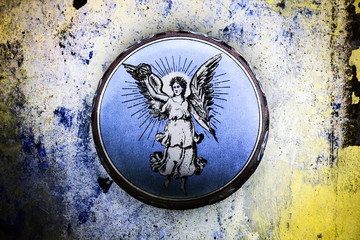 wonderful old tin can with angel motif on grunge background